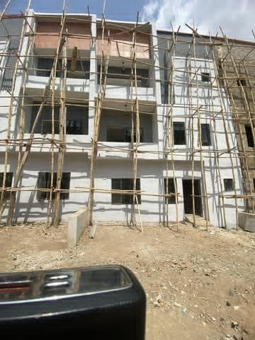 Front of the building with scaffold up to the third floor