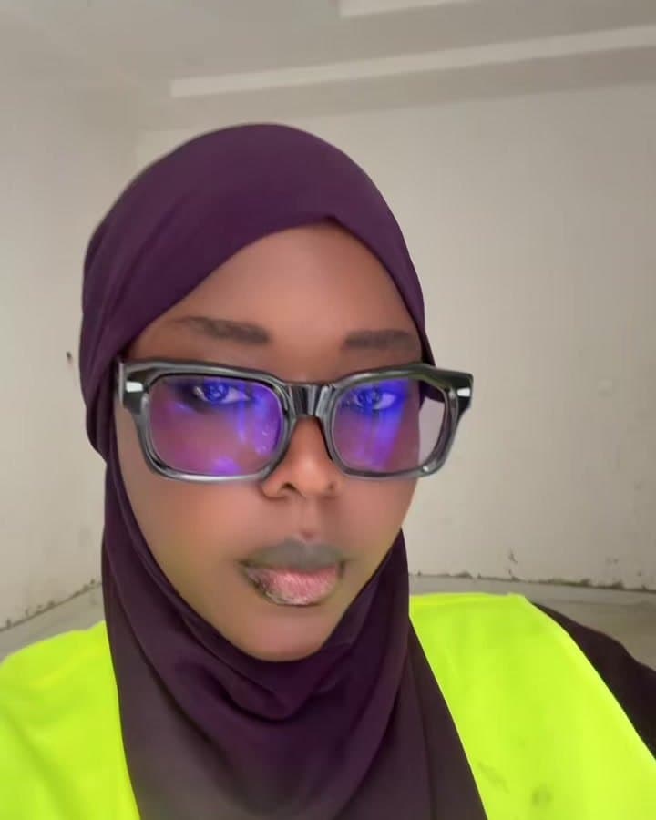 Saida Bajeh on site in a hi-vis vest and glasses